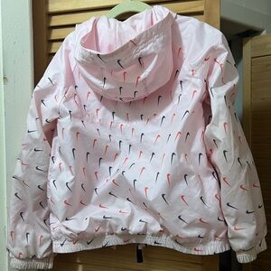 Nike lightweight rain jacket. Color pink. Size 6-7 years old. Worn few times
